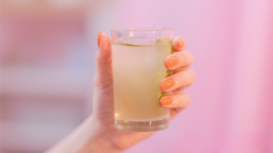 Holding-Pickle-Juice-Glass-Period-Relief