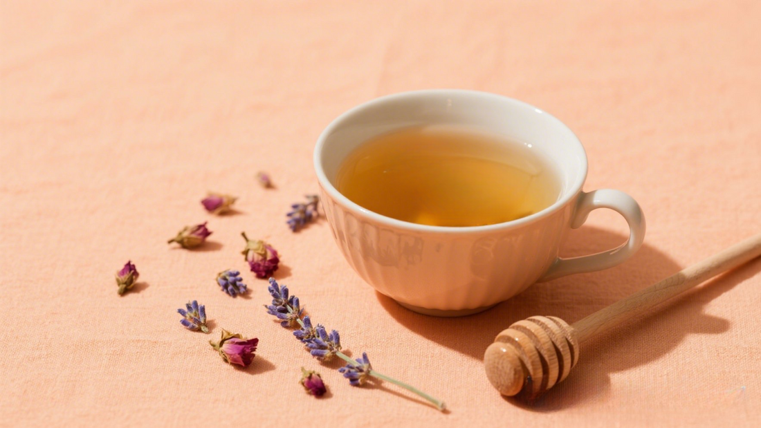 chamomile lavender tea on pastel orange cloth with honey and dried flowers